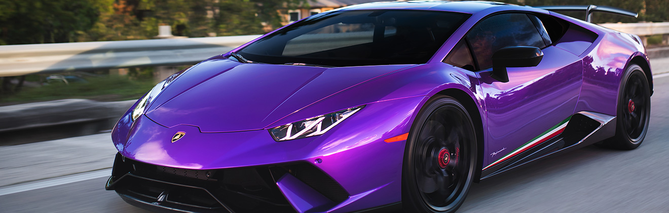 XPEL PRIME XR PLUS Automotive Window Tint on a purple Lamborghini on road